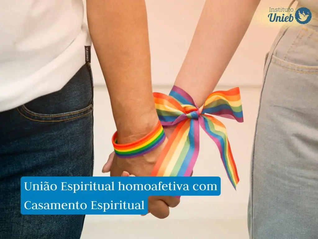 Duas pessoas segurando as mãos com um laço em cor de arco-íris amarrando as mãos