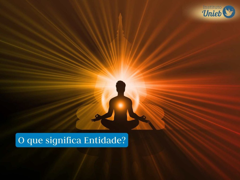 Entidades: o que são e como suas representações influenciam na saúde? Silhueta humana em posição de meditação com luzes ao redor representando Entidade Espiritual